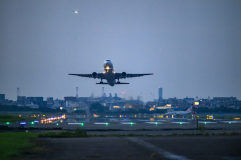 A commercial plane taking off from a runway.