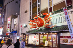 A famous Dotonbori restaurant, adorned with a giant crab statue.